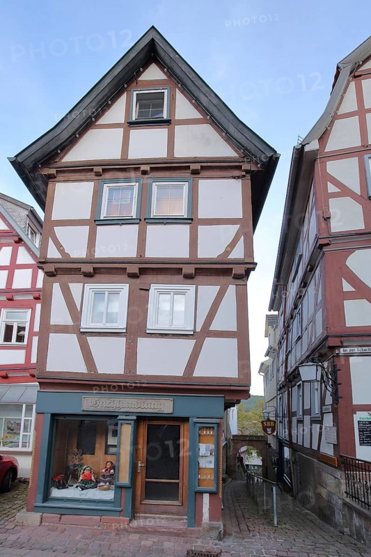 Narrow half-timbered house and bookshop