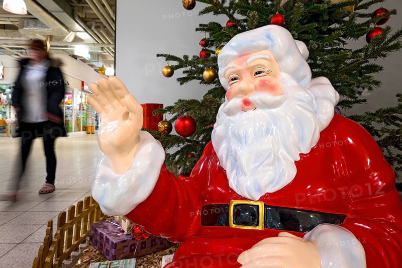 Father Christmas waving to passers-by
