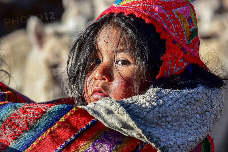Small child in sling in traditional dress of the Quechua Indians