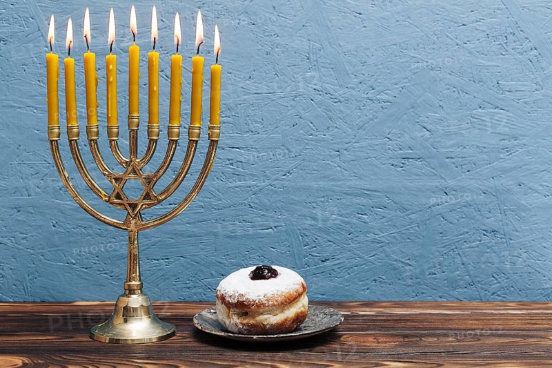 Jewish menorah with tasty donut