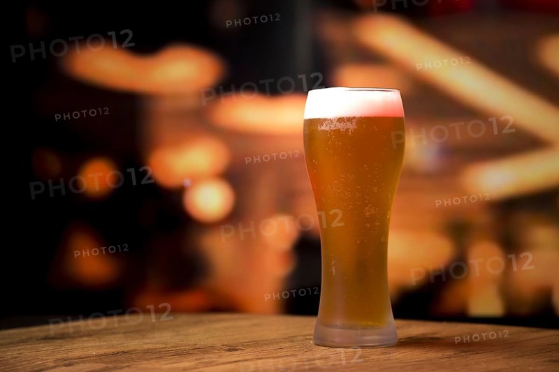 Beer glass front blurred background