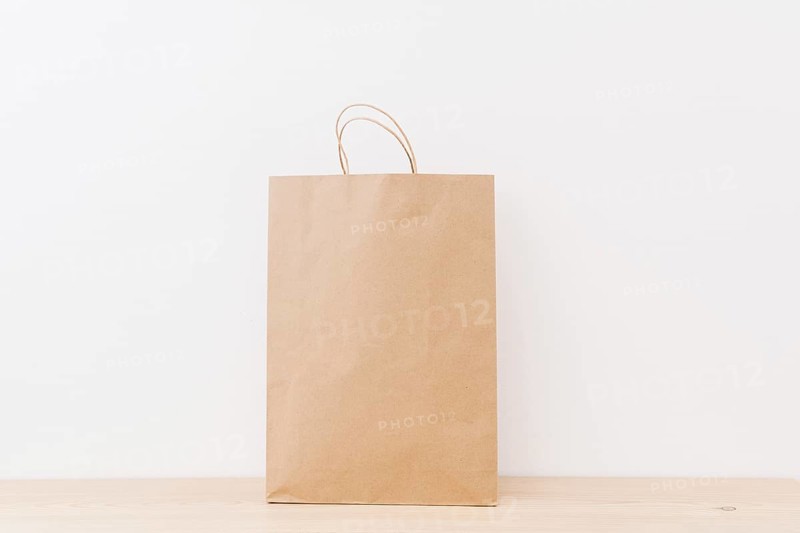 Brown shopping bag wooden surface