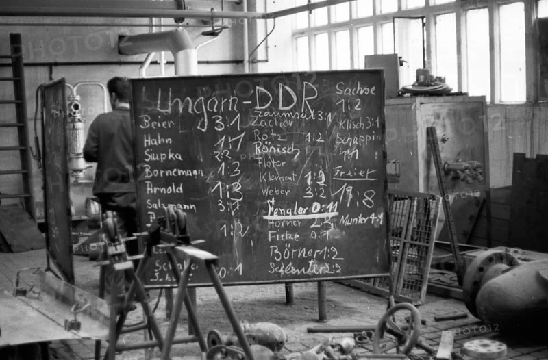 The picture was taken between 1965 and 1971 and shows a photographic impression of everyday life in this period of the GDR. Bitterfeld . Industrial complex. Football fans