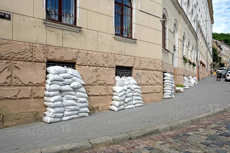 Sandbags on house facade in Lviv