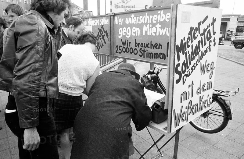 Tenants protest with a collection of signatures