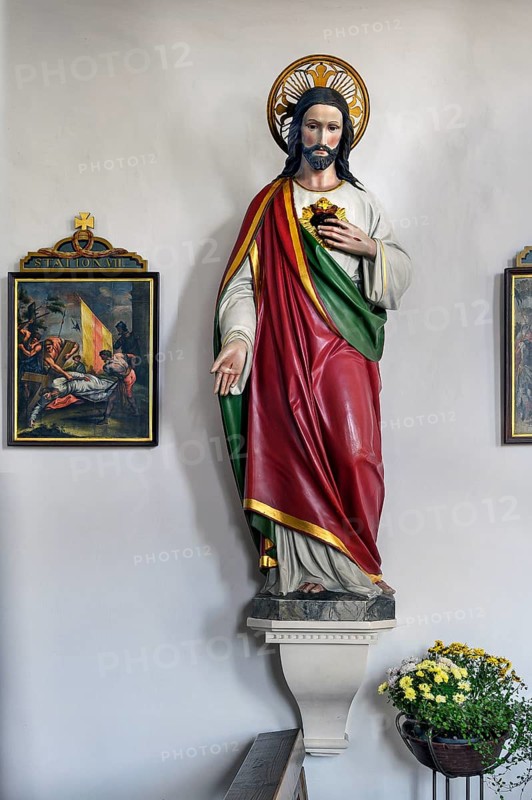 Christ figure with floral decoration