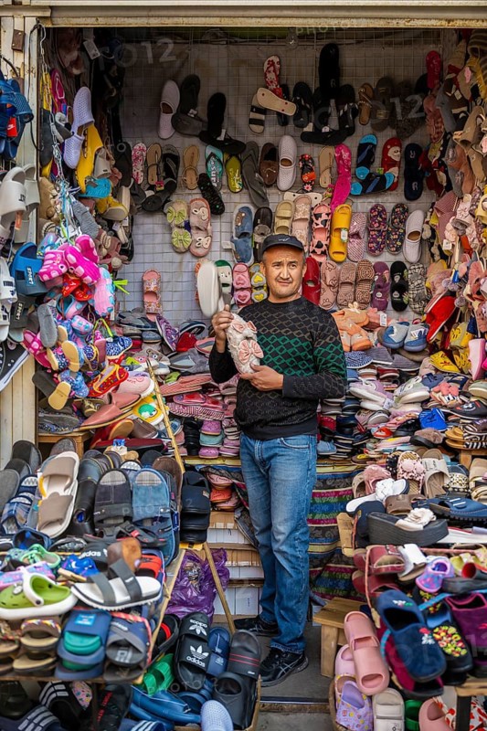 Vendor of shoes in his stall