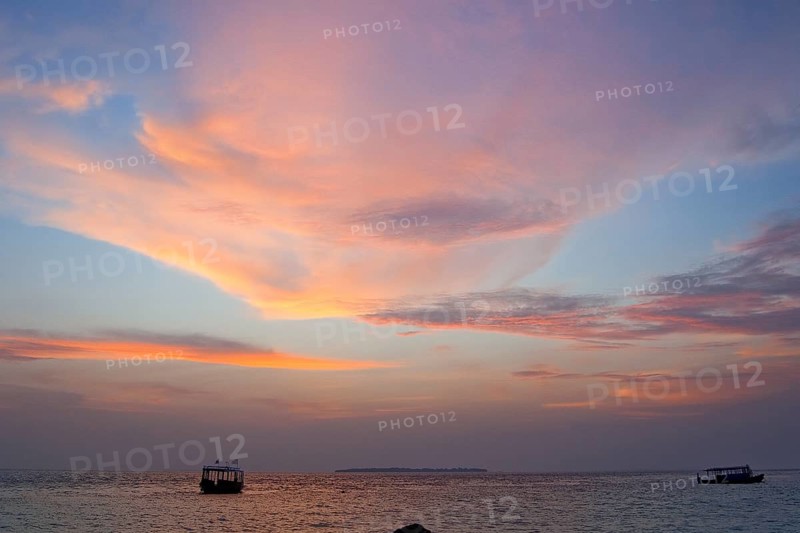 Altostratus clouds illuminated by setting sun at sunset