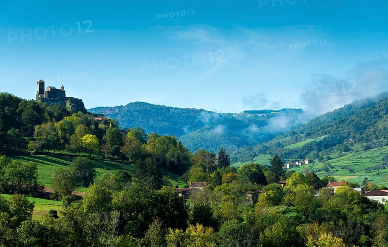 Saint-Ilpize castle perched on a volcanic peak above river Allier. Haute-Loire department. Auvergne-Rhone-Alpes. France