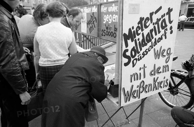 Tenants protest with a collection of signatures