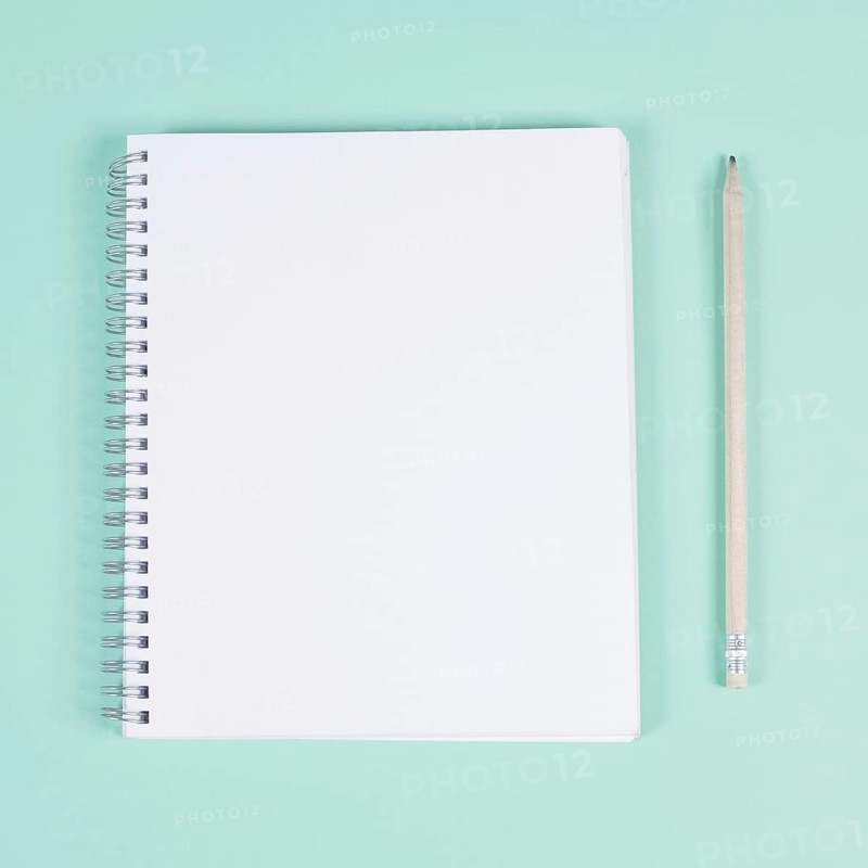 Blank spiral notebook with pencil turquoise background
