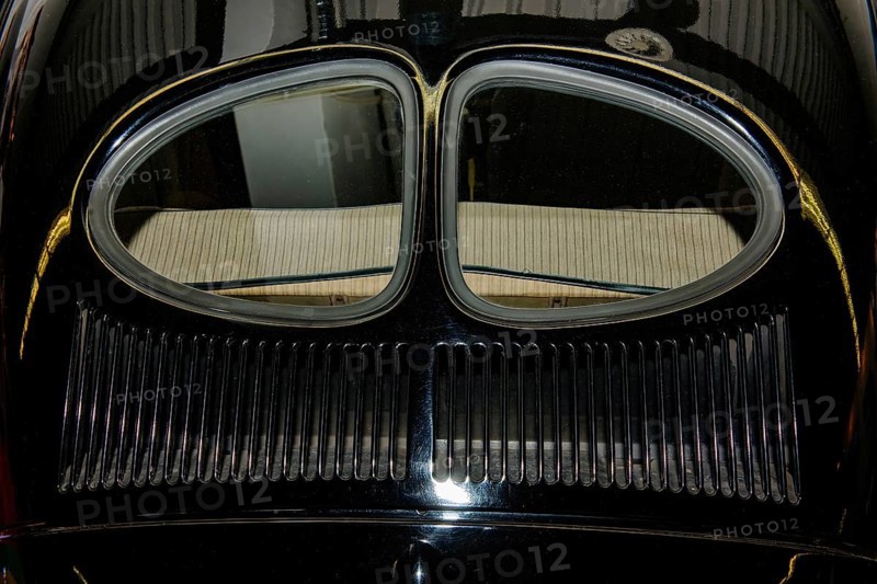 Rear section of historic Volkswagen VW Pretzel Beetle from 1938 with split rear window and 46 air vents Ventilation vents in radiator grille of bonnet