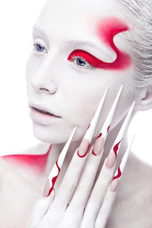 Art fashion girl with long color nails