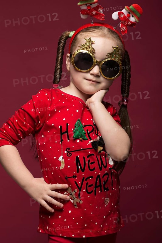 Funny little girl in the New Year's image