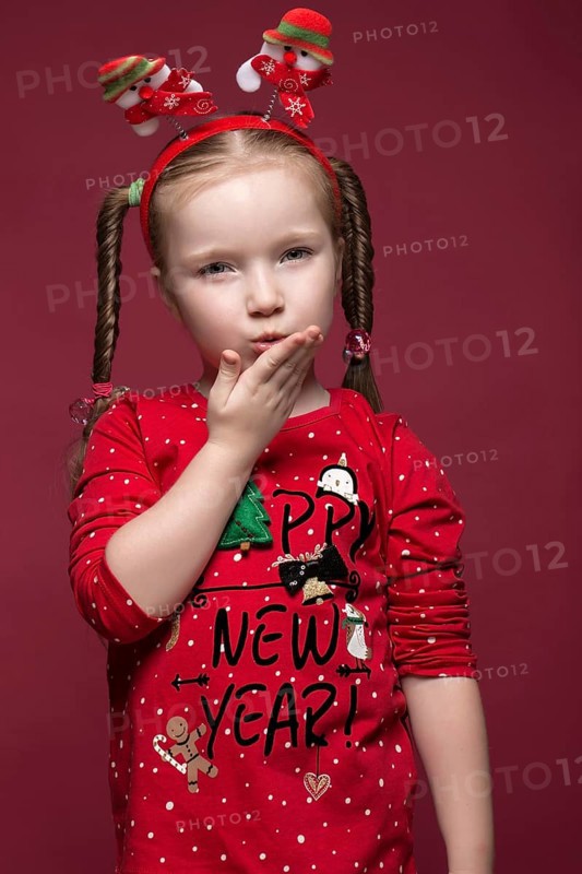 Funny little girl in the New Year's image