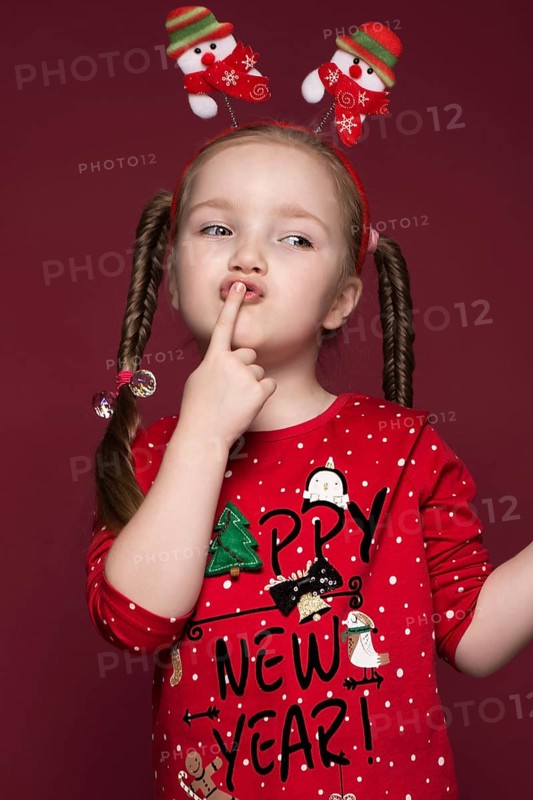 Funny little girl in the New Year's image