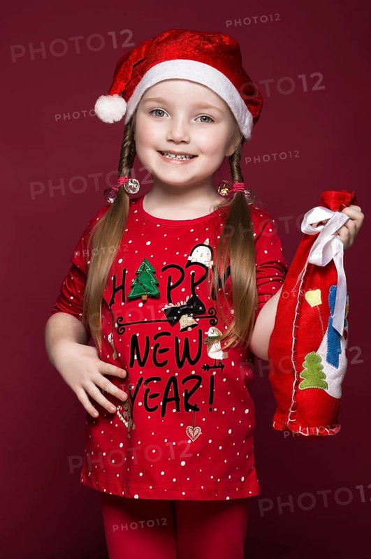 Funny little girl in the New Year's image