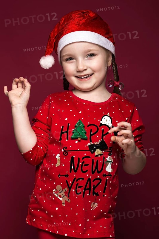 Funny little girl in the New Year's image
