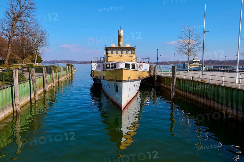 Lake Ciemsee with pier and paddle steamer