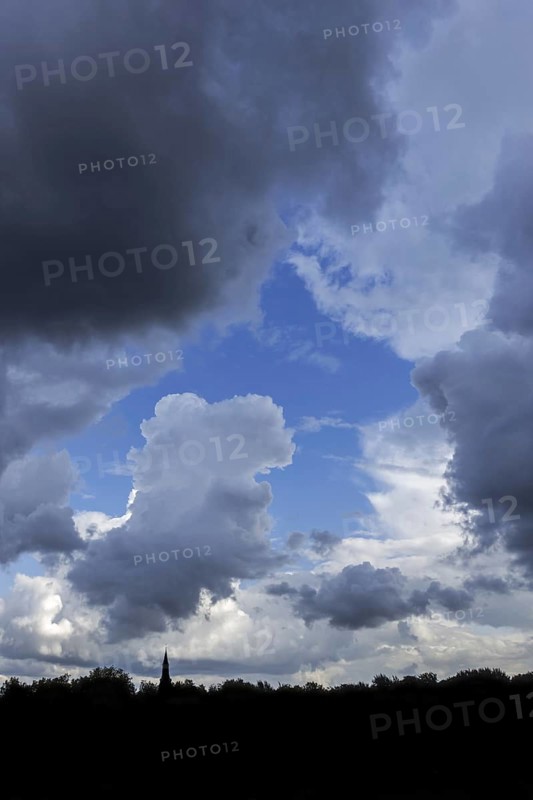 Gap in white and grey clouds