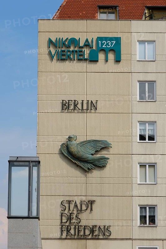 House facade with dove and lettering City of Peace