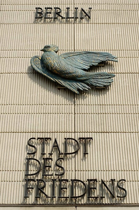 House facade with dove and lettering City of Peace