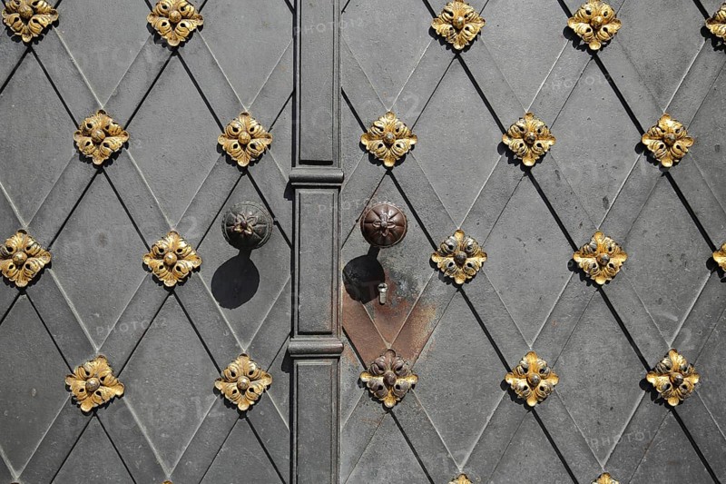 Door with golden fittings and doorknob