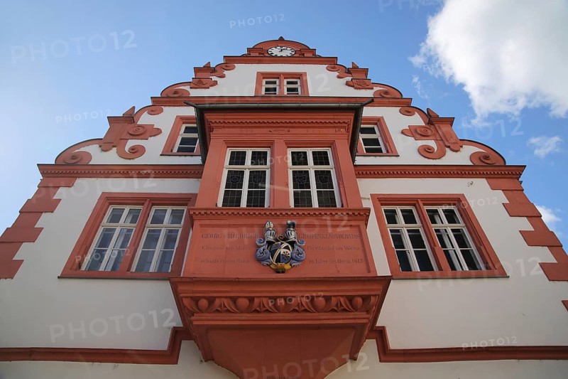 Renaissance town hall with oriel and coat of arms and tail gable