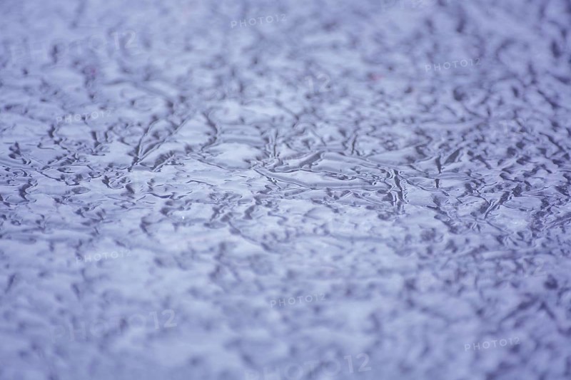 Frozen surface with water