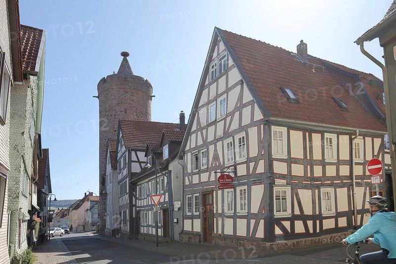 Historic Leonhard Tower built in 1386 and half-timbered house in Fuldauer Gasse
