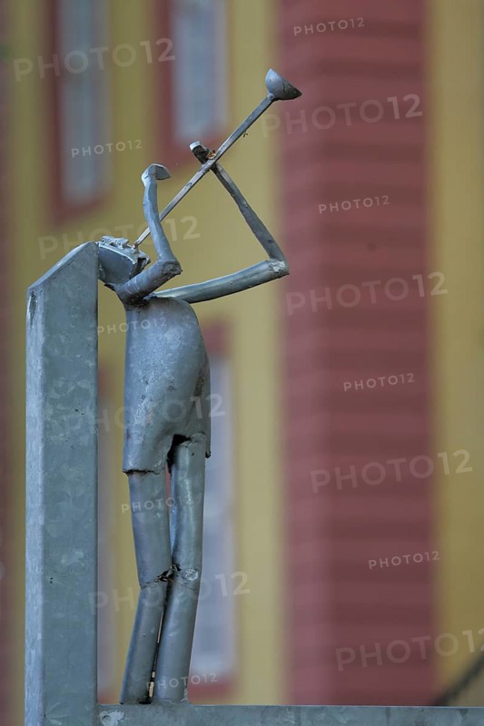 Modern sculpture as trumpeter made of metal