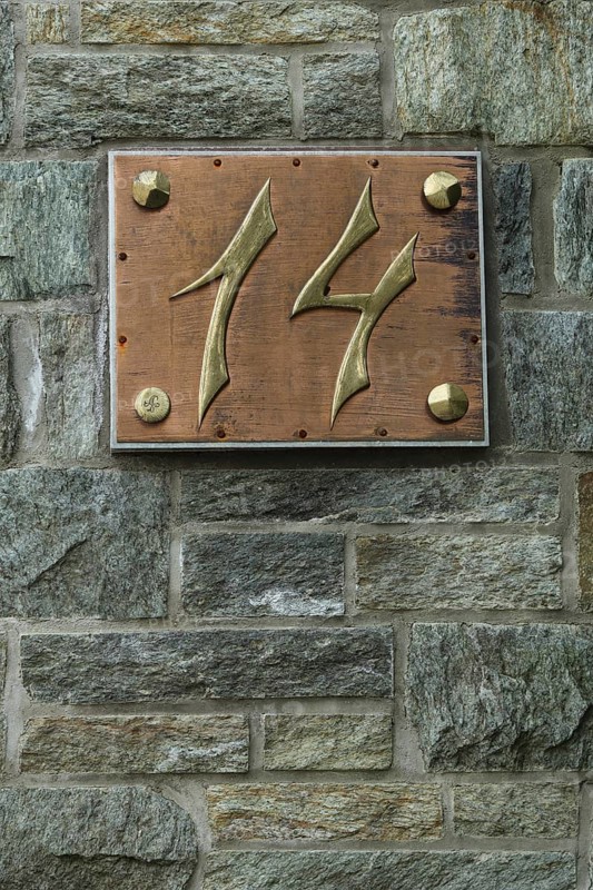 House number 14 made of brass with copper and rivets