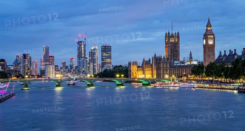 Westminster Bridge over the Thames with skyline and Houses of Parliament at dusk