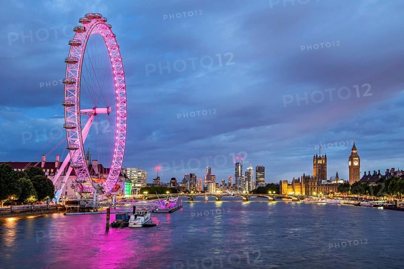 London Eye Ferris Wheel on the banks of the Thames at dusk