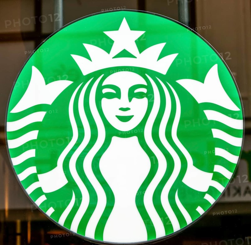 Close up of Starbucks twin-tailed siren brand logo sign