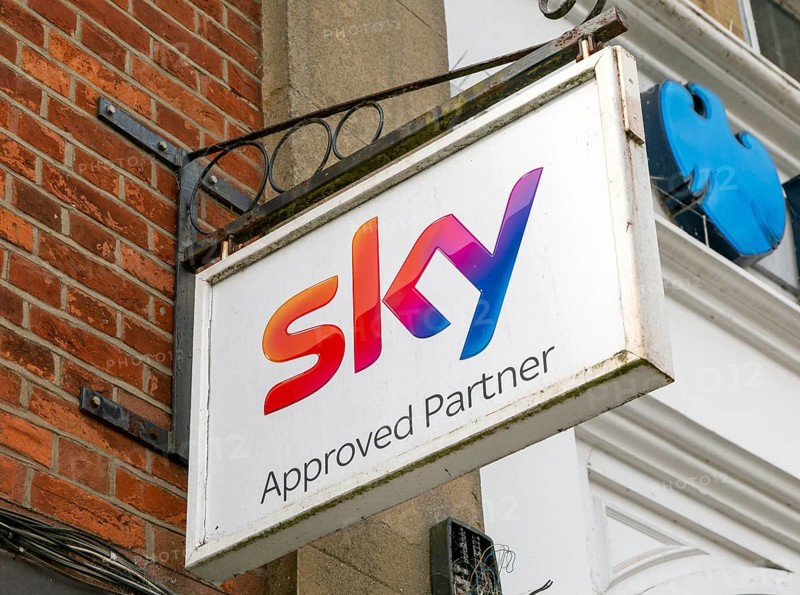 Sky Approved Partners wall hanging sign outside shop
