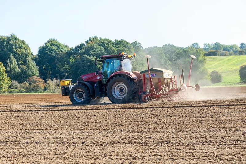 CASE 12 150 red tractor harrowing fiels
