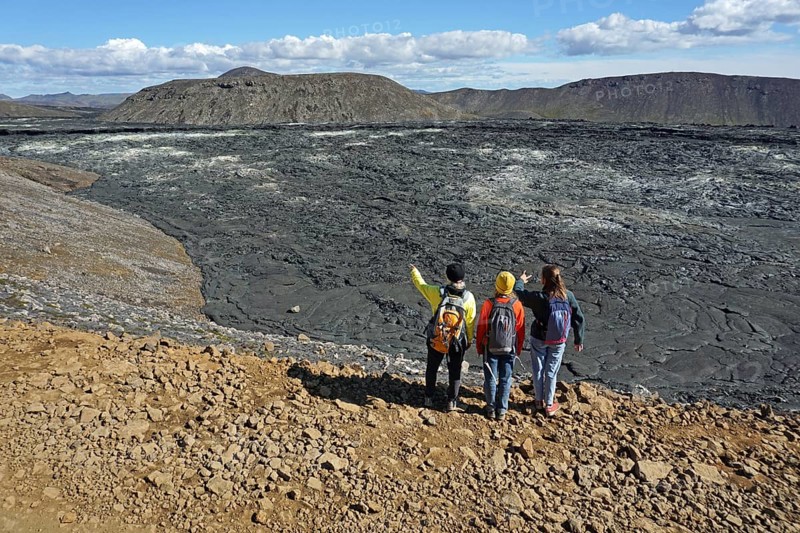 Hikers look down on solidified lava