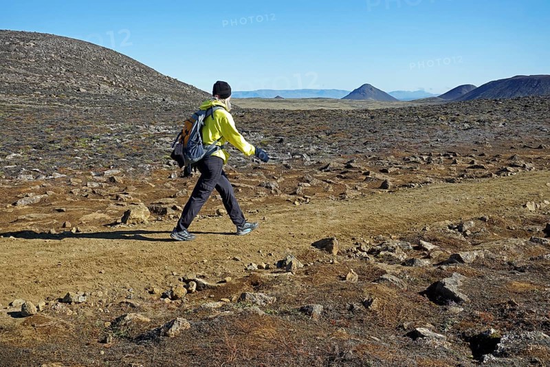 Hiker in volcanic landscape
