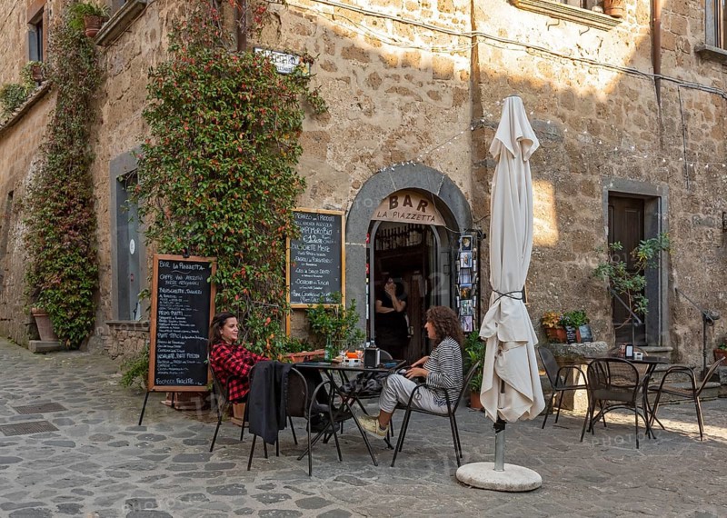 Two women at a street cafe