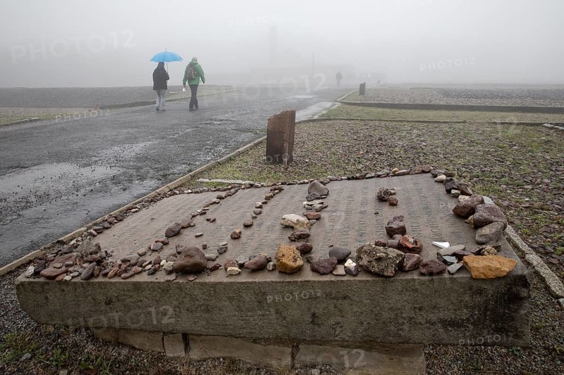 Memorial plaque with crematorium in the fog at beech forest Concentration Camp