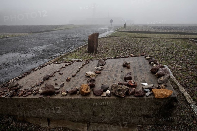 Memorial plaque with crematorium in the fog at beech forest Concentration Camp