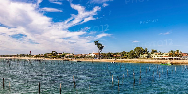 Village view with beach and lighthouse