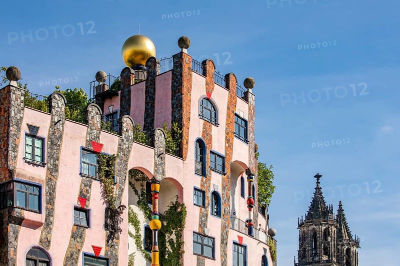 Facade of the architectural work of art Green Citadel and Magdeburg Cathedral