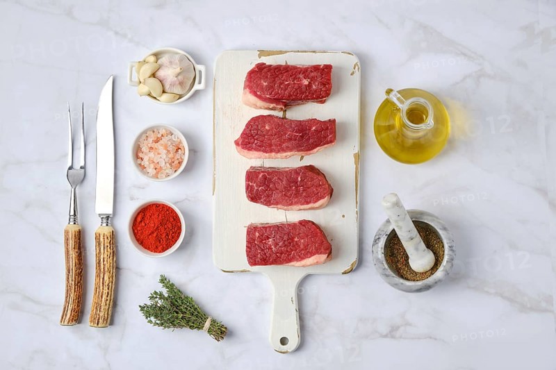 Top view of raw beef brisket flat steak with spice ready for cooking