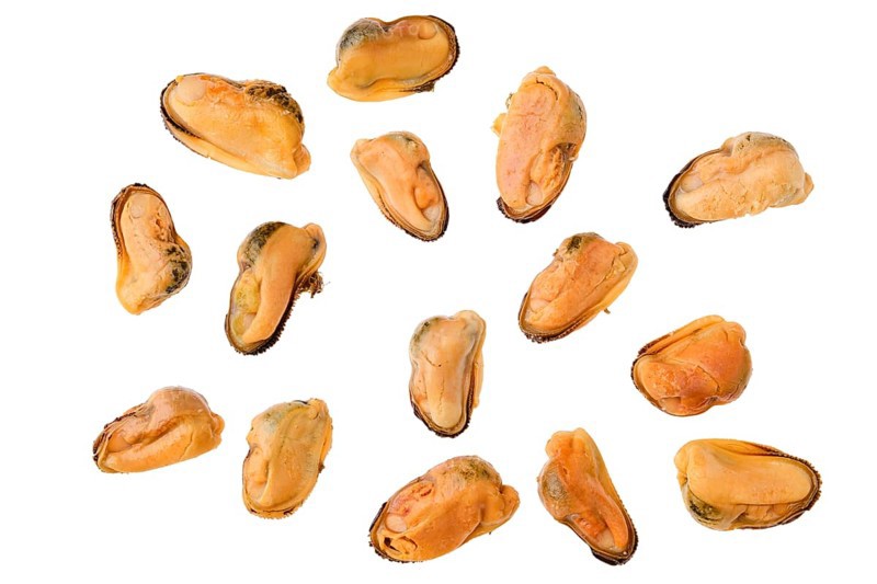 Top view of boiled and peeled mussels isolated on white background