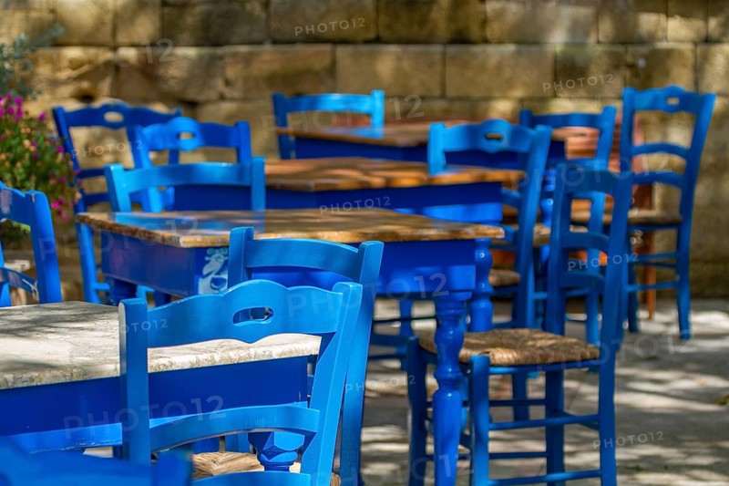 Blue tables and chairs in a cafe