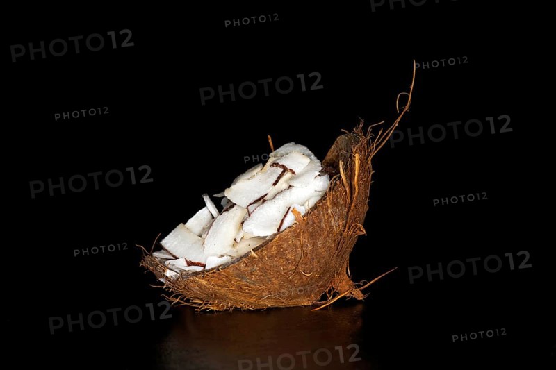 Finely sliced coconut meat in a coconut shell