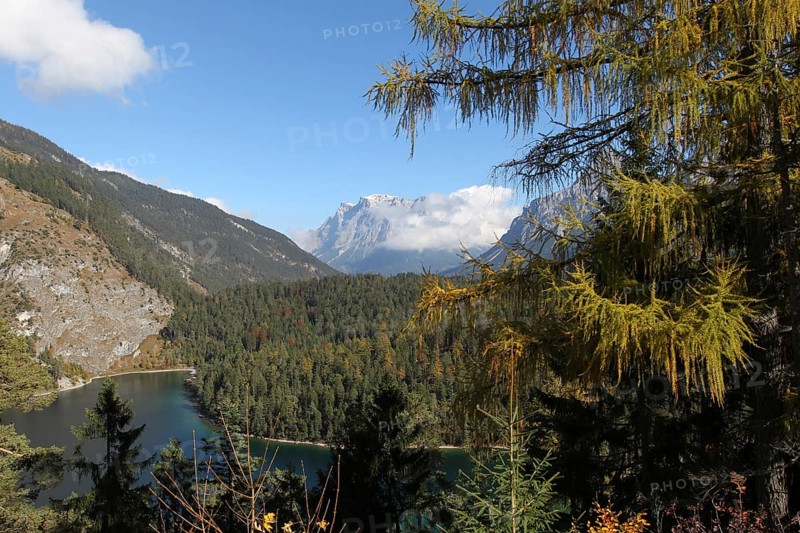 View of the Zugspitze massif with Blindsee lake in autumn