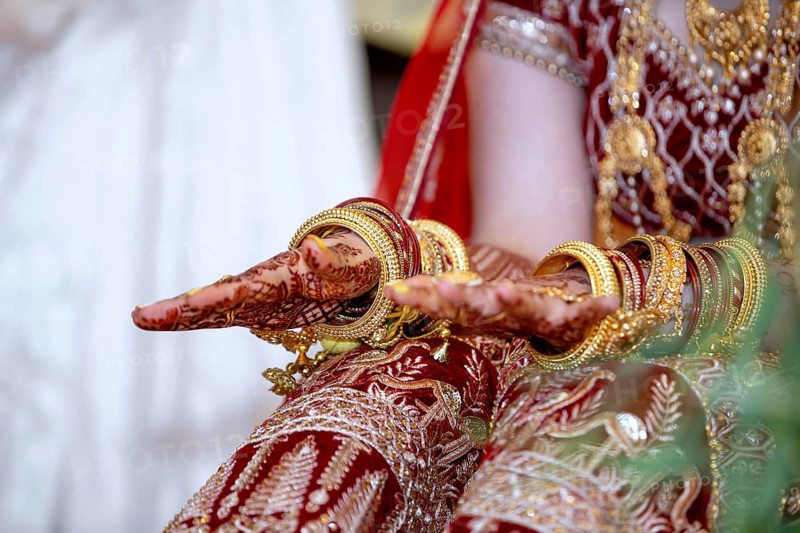 Traditional bridal jewelry and henna decoration on the hands of Hindu bride on her wedding day